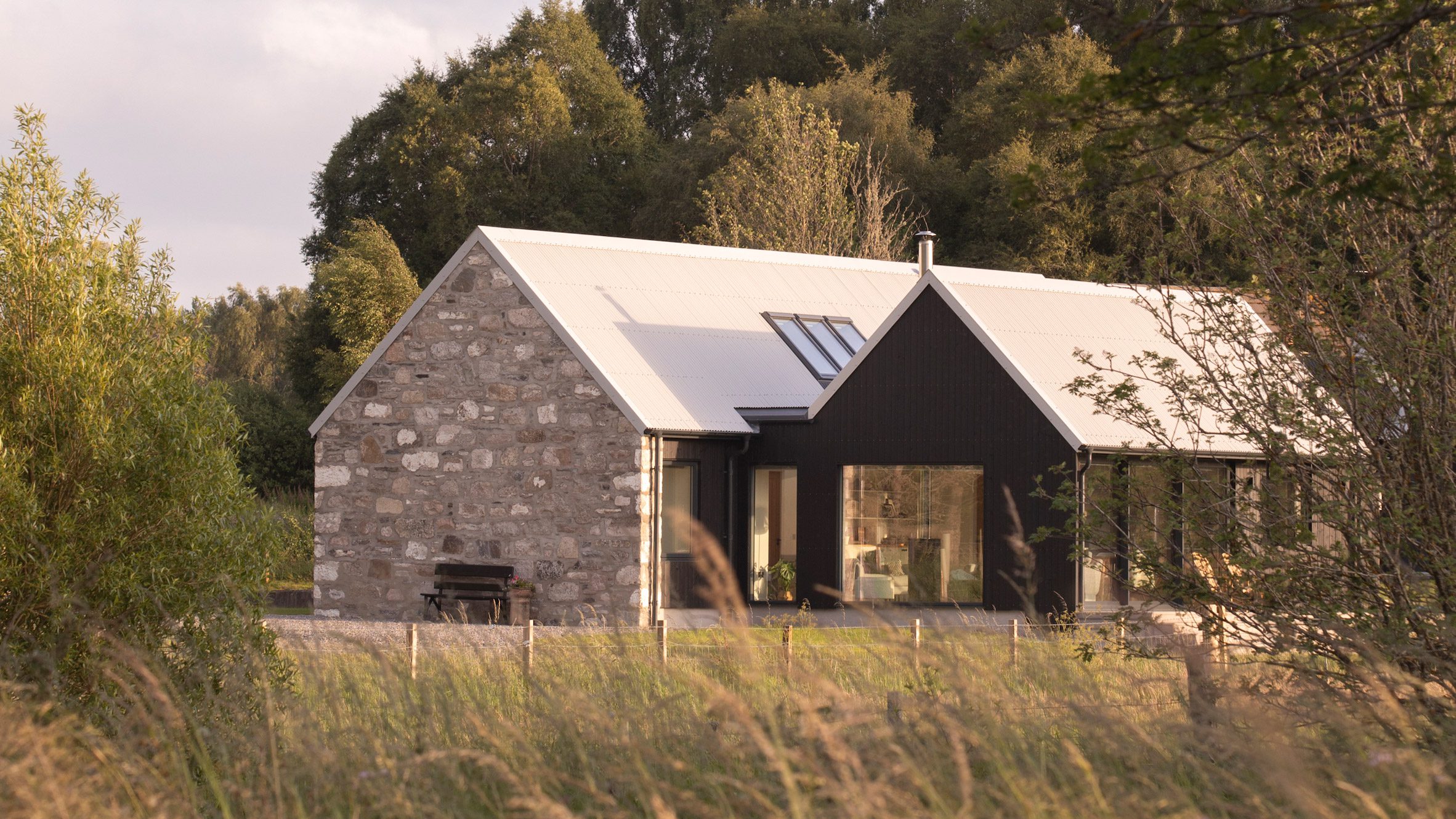 dulnain-croft-house-loader-monteith-salvaged-granite-blackened-larch-scotland-hero_dezeen_2364_col_2